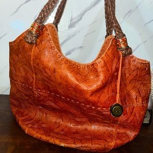 The Sak Bucket Bag with Chestnut Etched Leather and Woven Dark Leather Straps